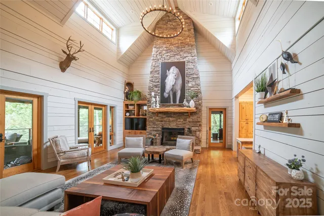 a living room with fireplace furniture and a fireplace