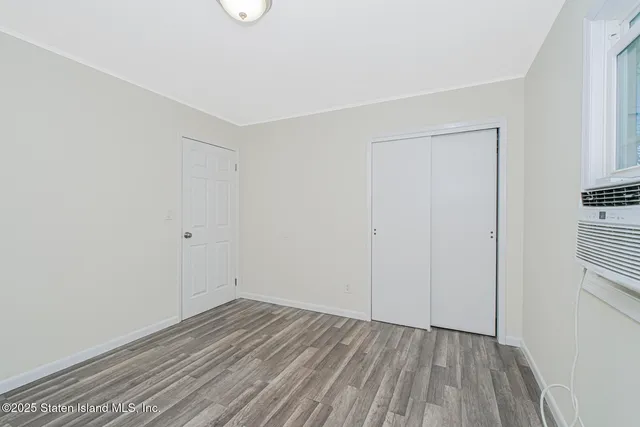 a living room with furniture and a book shelf