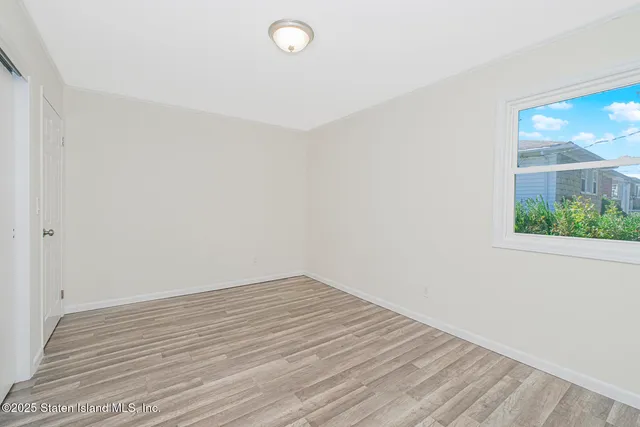 a view of a workspace with furniture and book shelf