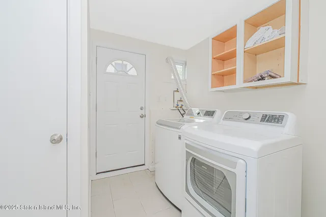 a kitchen with a table chairs stove and cabinets