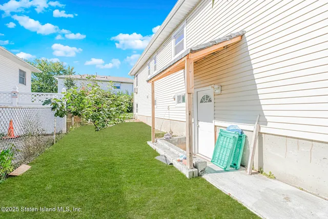 a front view of a house with parking space