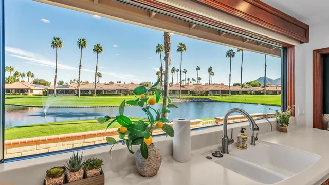 a living room with a fireplace and a flat screen tv