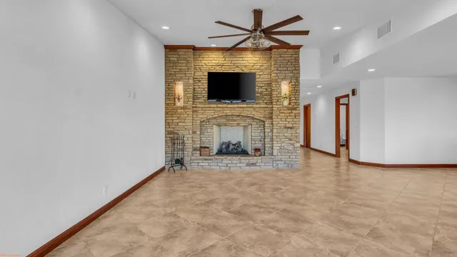 a bathroom with a granite countertop shower