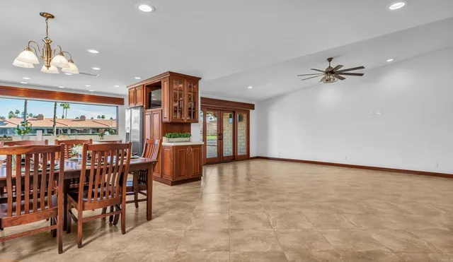 an open kitchen with dining table and chairs