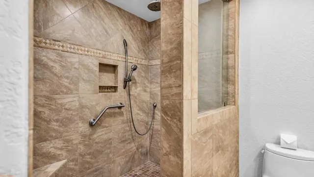 a bathroom with double sink and a mirror