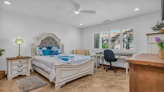 a swimming pool with outdoor seating and yard