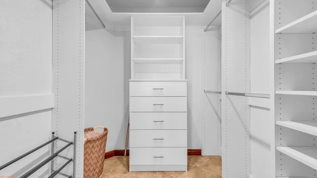 a view of green field with house in the background