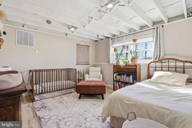 a bedroom with a bed and a table