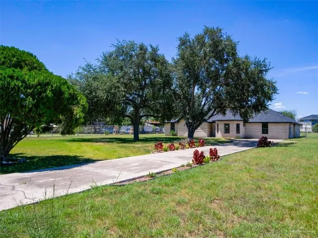 a view of a house with a yard porch and sitting area