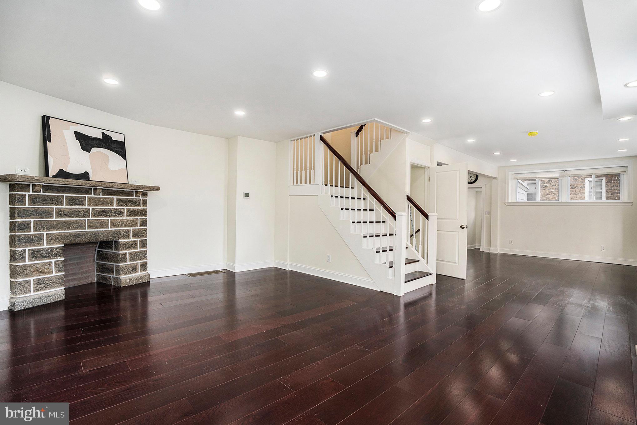 801 Marlyn Road Philadelphia, PA 19151 - Photo 8 of 27 a view of an empty room with wooden floor stairs and a way