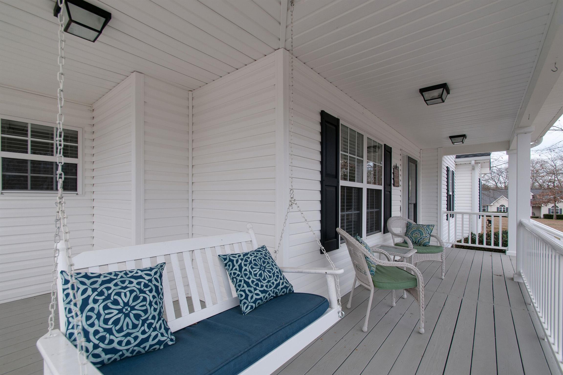 209 Contrary Road Burns, TN 37029 - Photo 2 of 17 Relax on the front porch swing