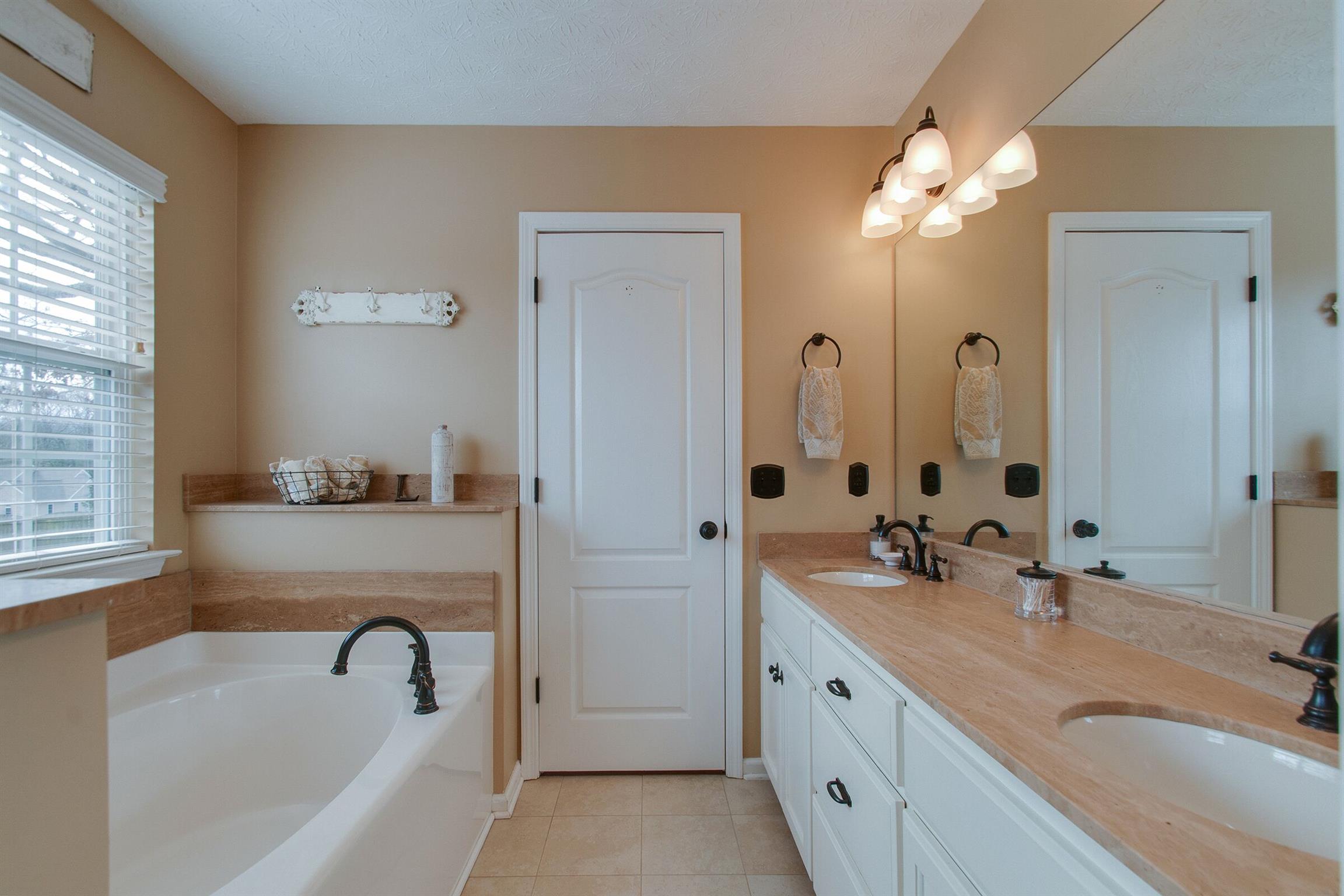 209 Contrary Road Burns, TN 37029 - Photo 12 of 17 Double vanity sinks with granite top Soaking tub