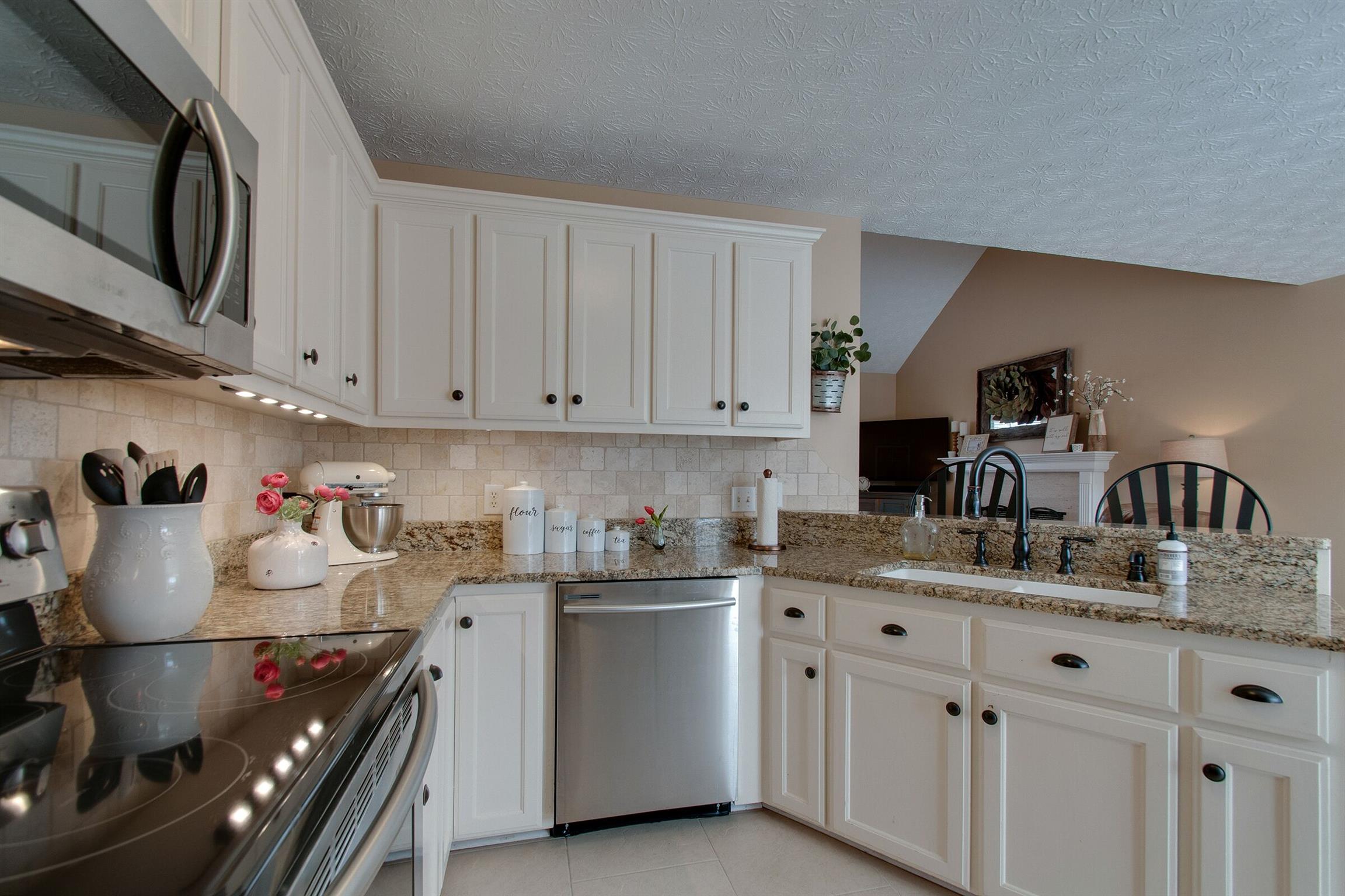 209 Contrary Road Burns, TN 37029 - Photo 4 of 17 Newly painted kitchen cabinets with granite counter tops and ship lap wood bar