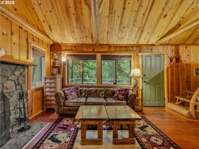 a room with pool table windows and wooden floor