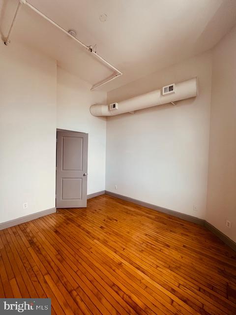 511 South Bond Street, Unit 304 Baltimore, MD 21231 - Photo 15 of 16 a view of a room with wooden floor