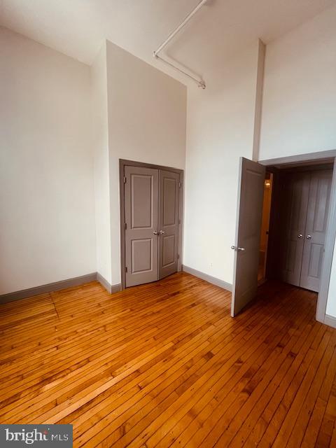 511 South Bond Street, Unit 304 Baltimore, MD 21231 - Photo 16 of 16 a view of an empty room with wooden floor