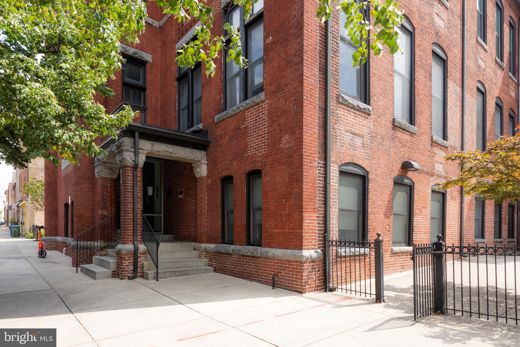 511 South Bond Street, Unit 304 Baltimore, MD 21231 - Photo 2 of 16 a view of a building with a tree