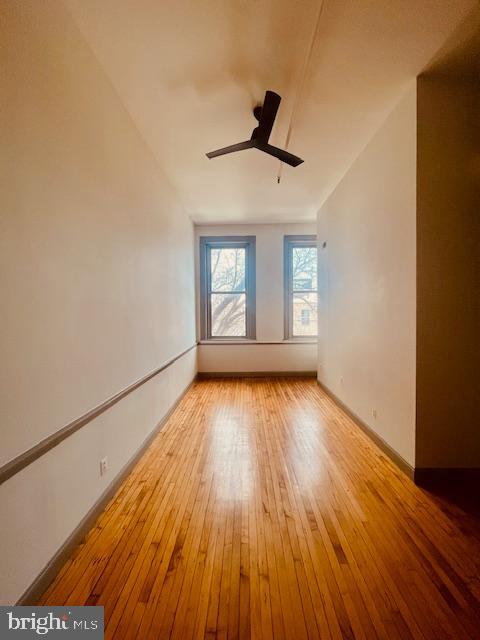 511 South Bond Street, Unit 304 Baltimore, MD 21231 - Photo 3 of 16 a view of empty room with wooden floor and fan