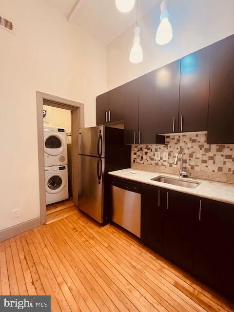 511 South Bond Street, Unit 304 Baltimore, MD 21231 - Photo 9 of 16 a kitchen with stainless steel appliances granite countertop a refrigerator and a sink