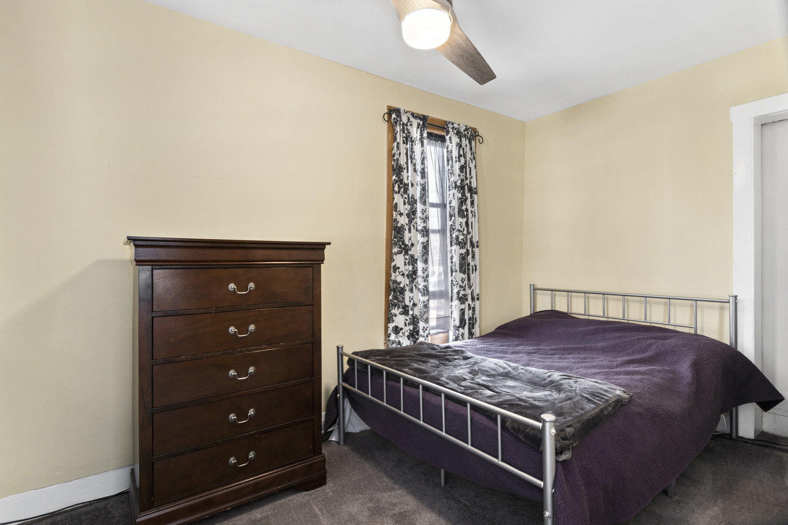 107 Spring Street Cary, IL 60013 - Photo 10 of 23 a bed sitting in a room next to a window