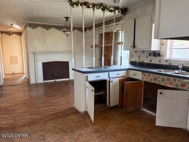 13835 Old Jackson Road Whiteville, TN 38075 - Photo 11 of 27 a kitchen with cabinets and a fireplace