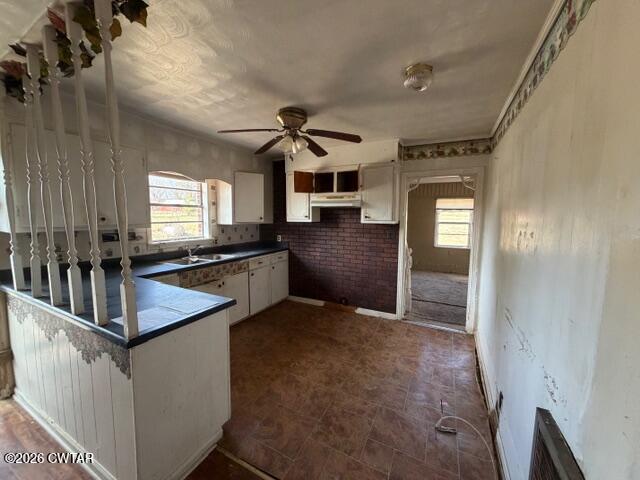 13835 Old Jackson Road Whiteville, TN 38075 - Photo 12 of 27 a kitchen with granite countertop a sink stove and refrigerator
