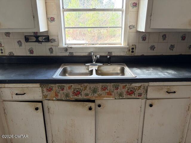 13835 Old Jackson Road Whiteville, TN 38075 - Photo 13 of 27 a kitchen with a sink a window and cabinets