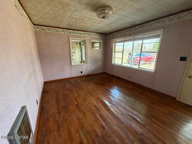13835 Old Jackson Road Whiteville, TN 38075 - Photo 17 of 27 a view of an empty room with wooden floor and a window