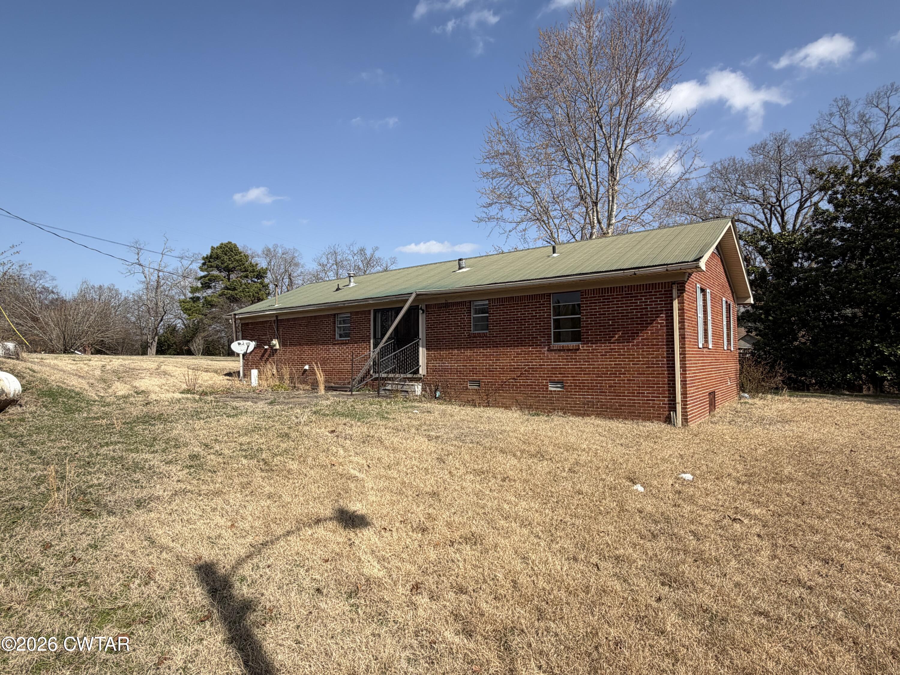 13835 Old Jackson Road Whiteville, TN 38075 - Photo 3 of 27 a view of a house with a yard
