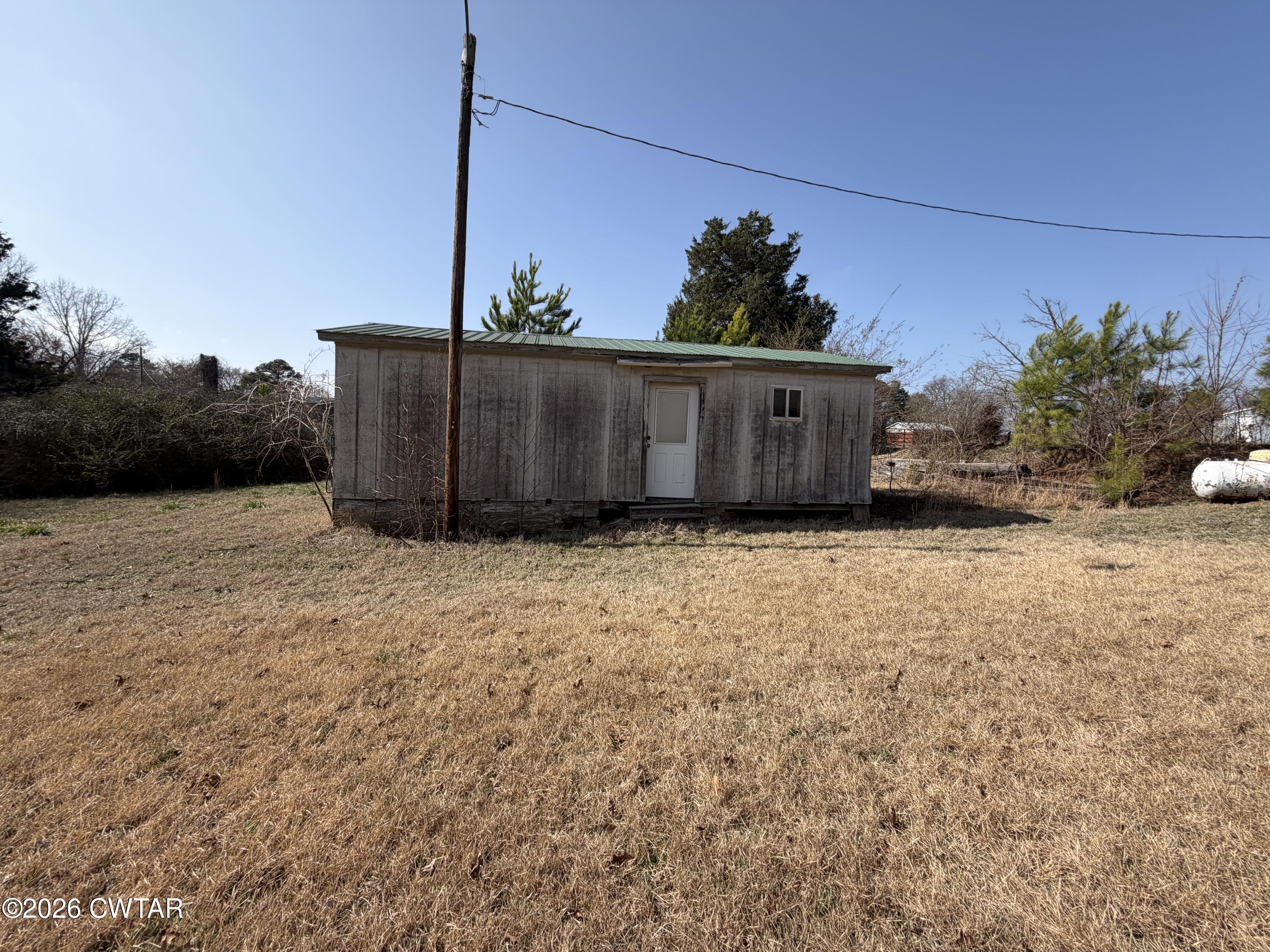 13835 Old Jackson Road Whiteville, TN 38075 - Photo 7 of 27 a view of a house
