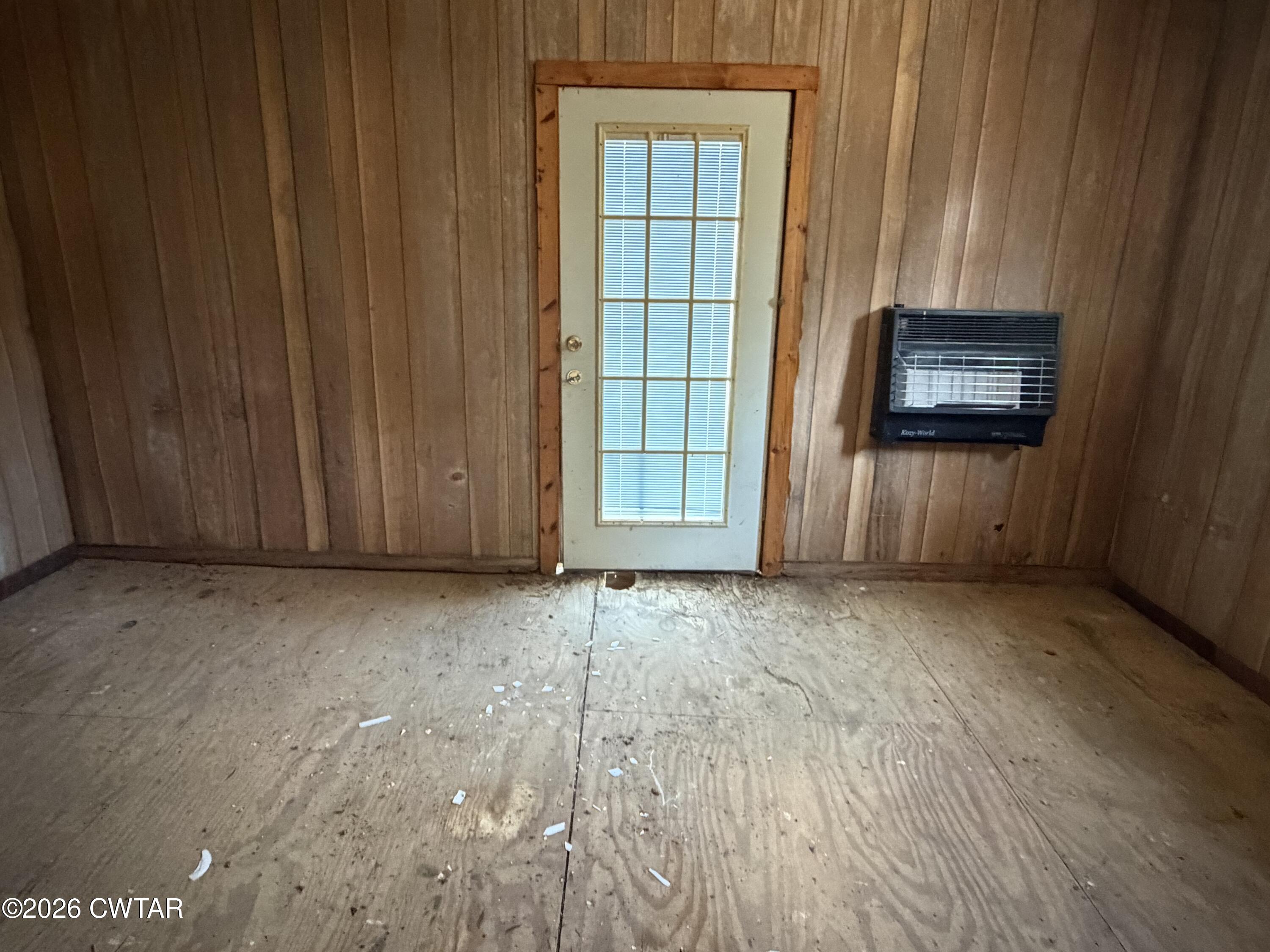 13835 Old Jackson Road Whiteville, TN 38075 - Photo 8 of 27 an empty room with windows