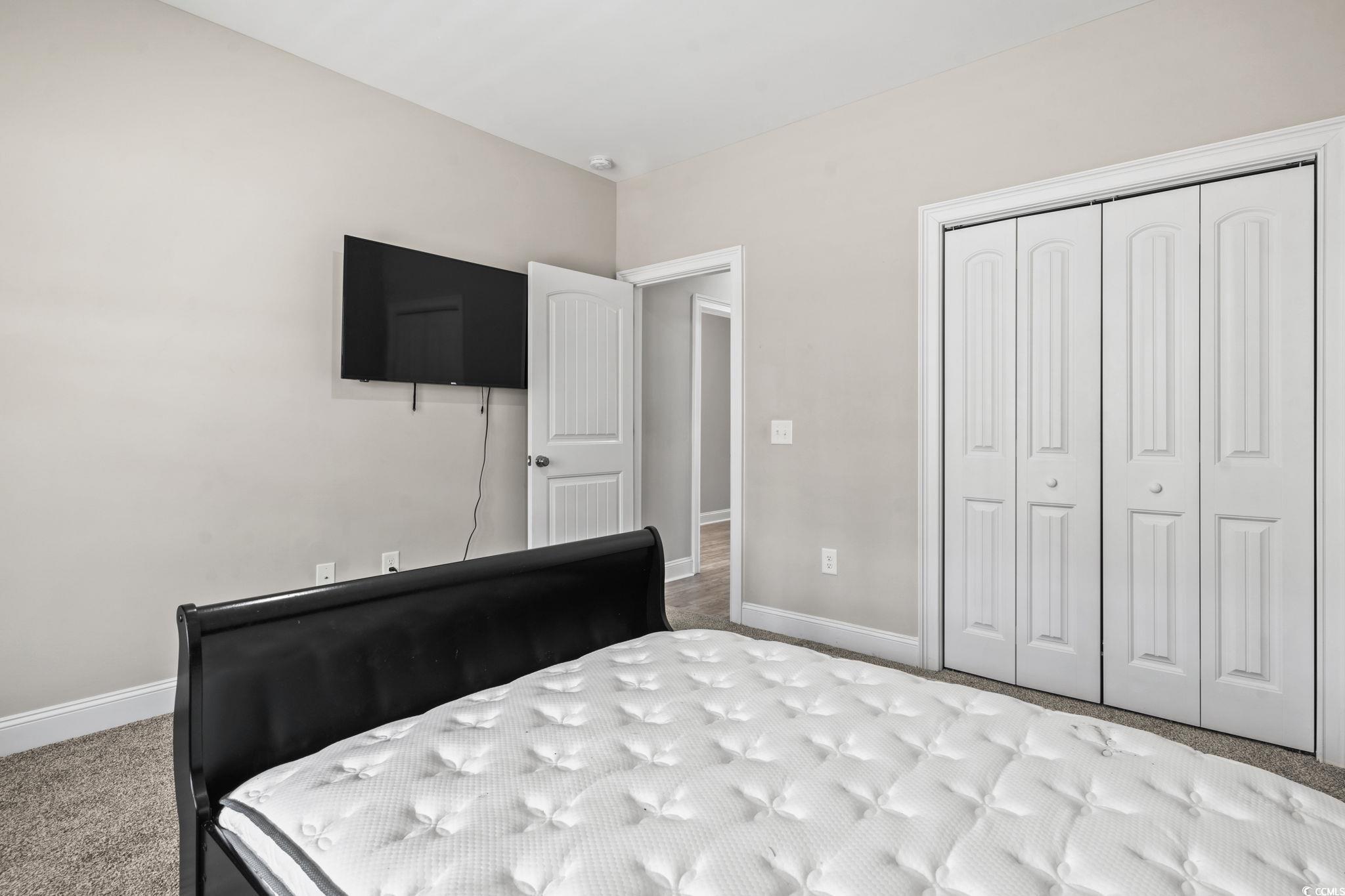 10015 West Highway 19 Loris, SC 29569 - Photo 12 of 40 Unfurnished bedroom featuring baseboards, a closet