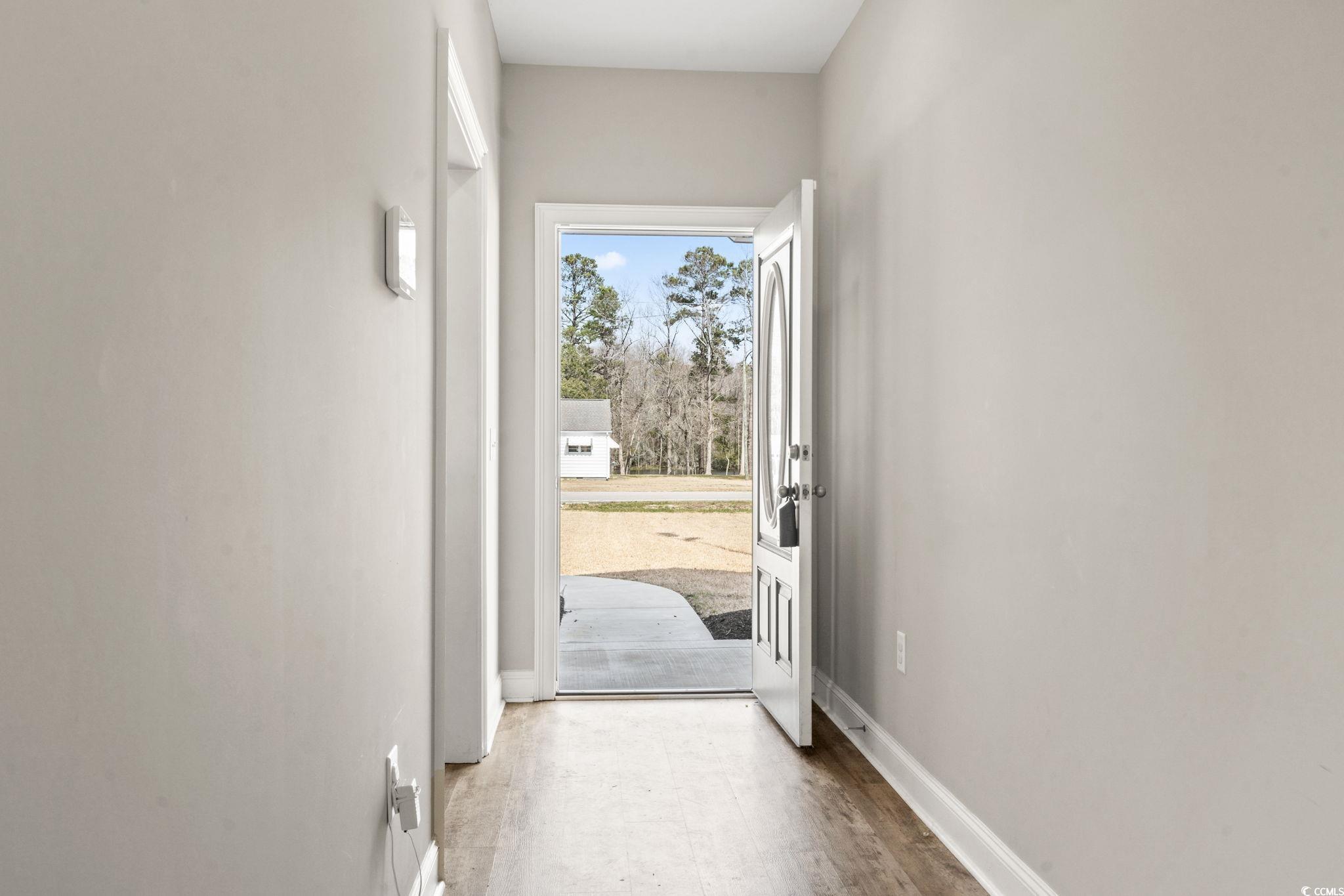 10015 West Highway 19 Loris, SC 29569 - Photo 14 of 40 Doorway to outside with baseboards and wood finish