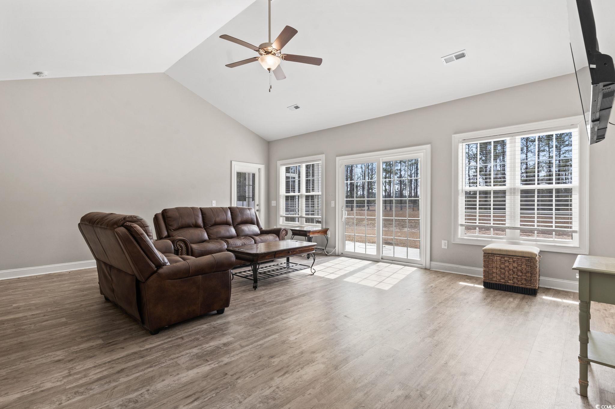 10015 West Highway 19 Loris, SC 29569 - Photo 16 of 40 Living area with visible vents, a ceiling fan, woo