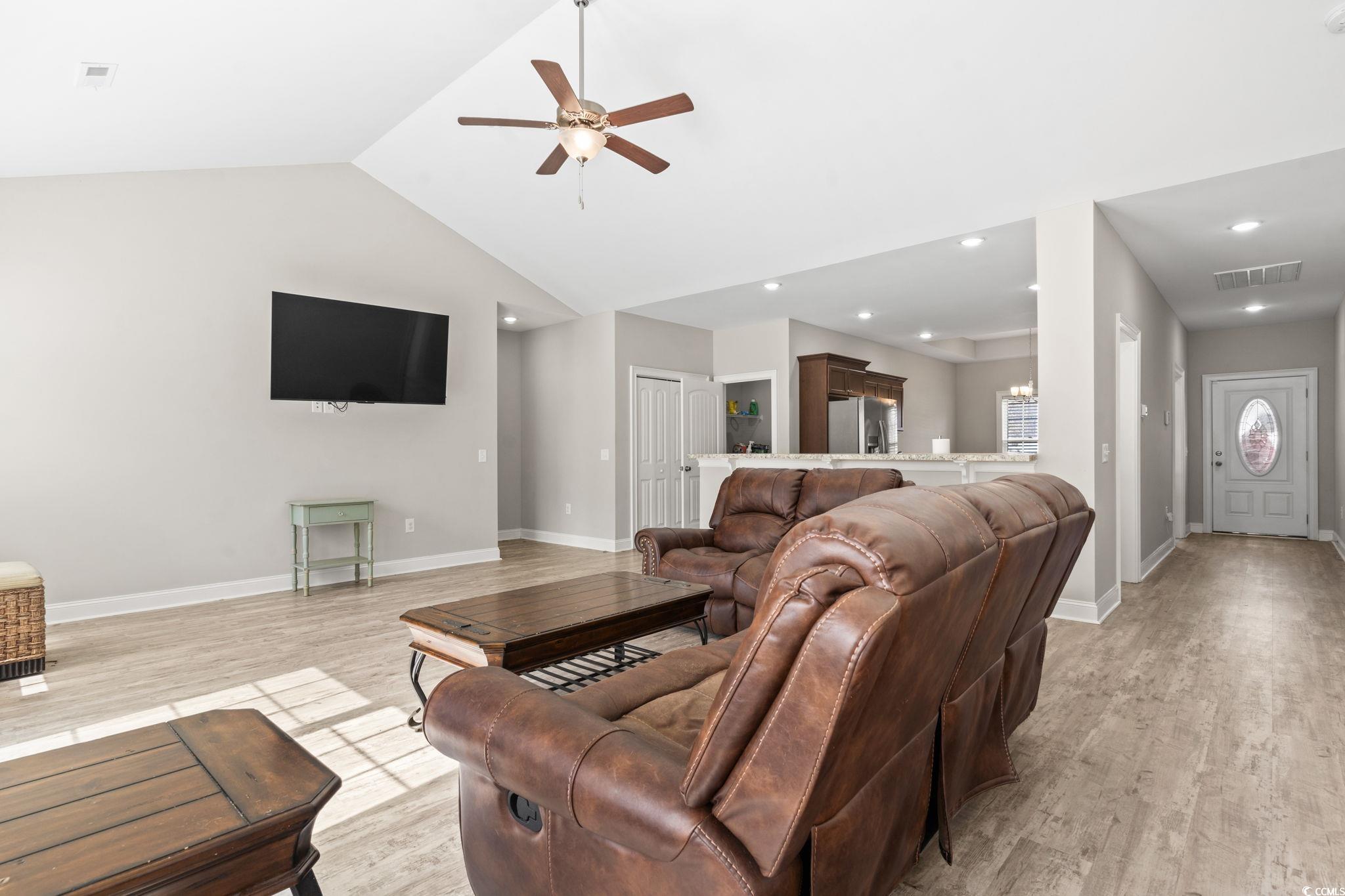 10015 West Highway 19 Loris, SC 29569 - Photo 19 of 40 Living area with visible vents, light wood-style f