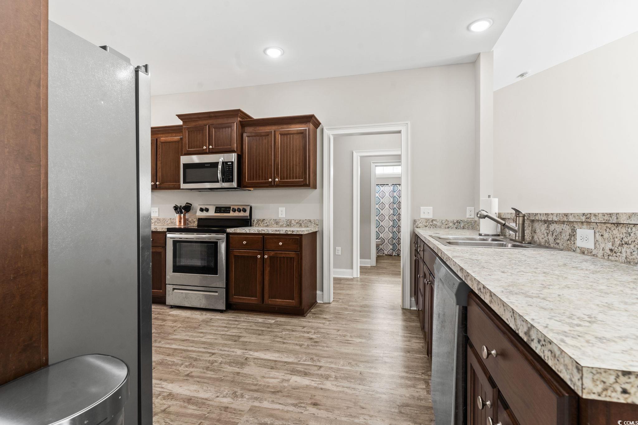 10015 West Highway 19 Loris, SC 29569 - Photo 21 of 40 Kitchen with recessed lighting, a sink, light wood