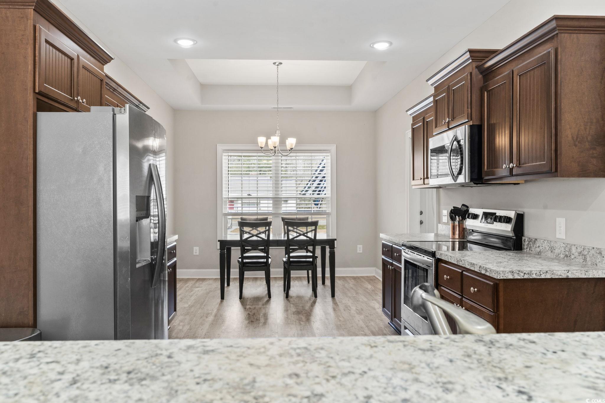 10015 West Highway 19 Loris, SC 29569 - Photo 22 of 40 Kitchen with a raised ceiling, light countertops,