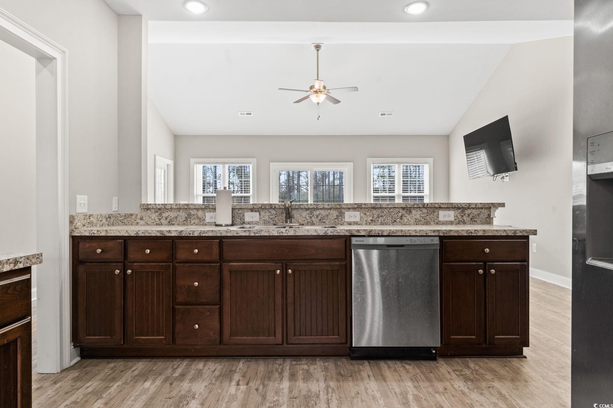 10015 West Highway 19 Loris, SC 29569 - Photo 24 of 40 Kitchen featuring lofted ceiling, dark brown cabin