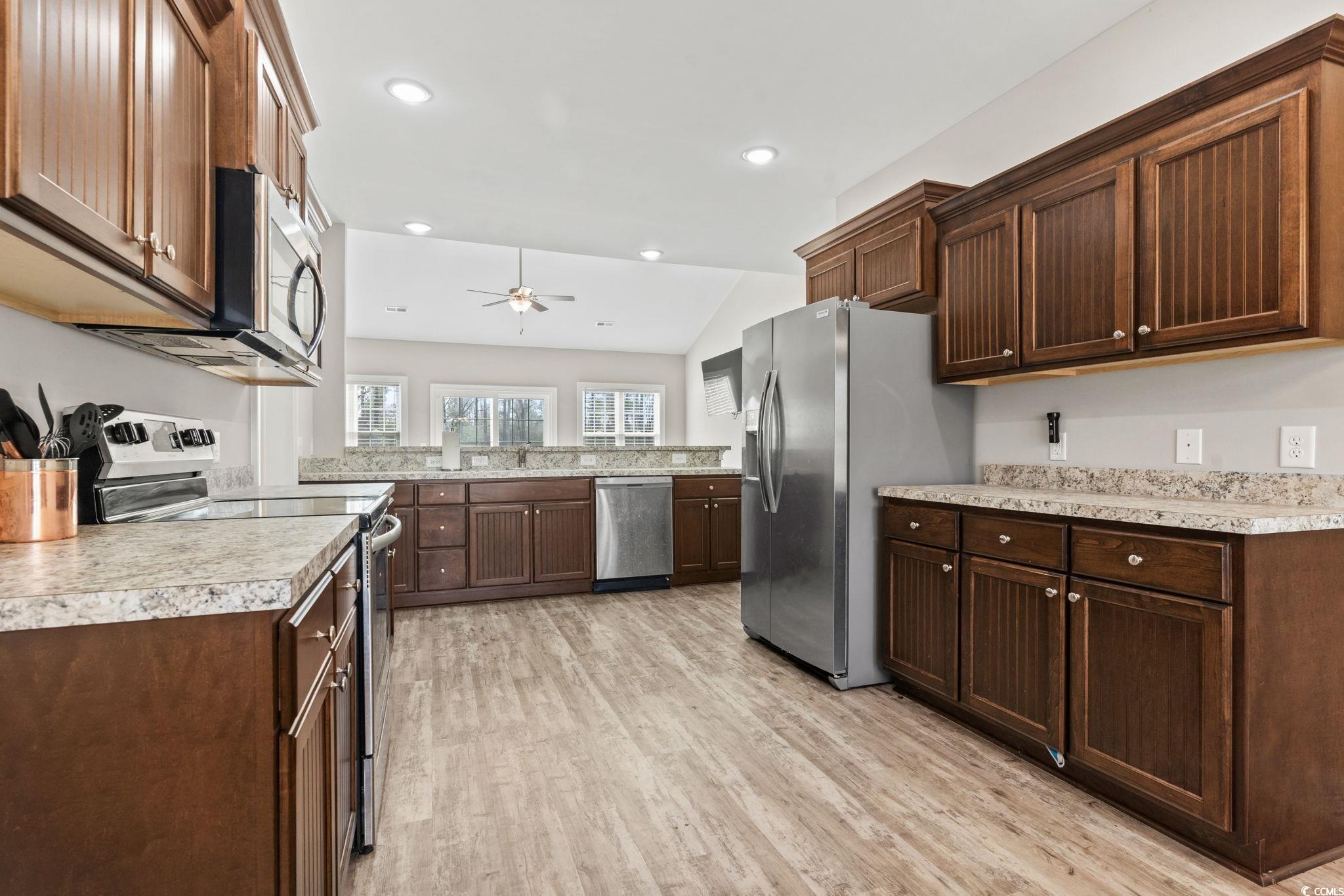 10015 West Highway 19 Loris, SC 29569 - Photo 28 of 40 Kitchen with light wood finished floors, light cou