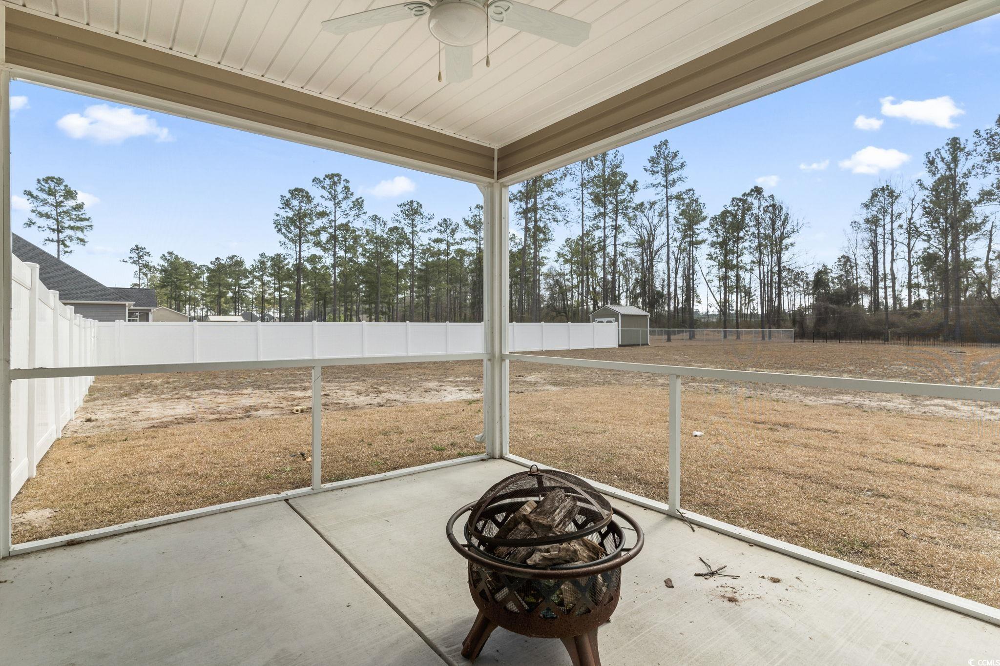 10015 West Highway 19 Loris, SC 29569 - Photo 31 of 40 View of patio / terrace with ceiling fan, an outdo