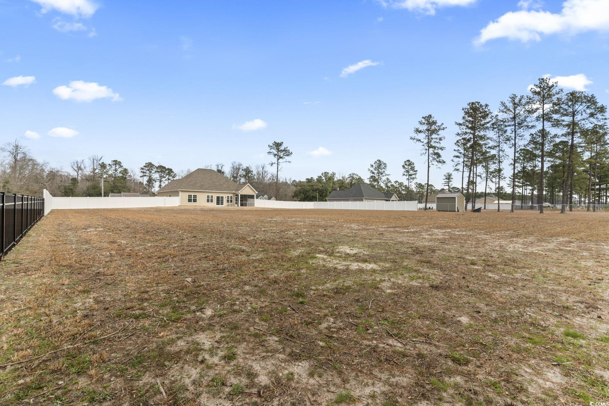 10015 West Highway 19 Loris, SC 29569 - Photo 34 of 40 View of yard featuring a fenced backyard