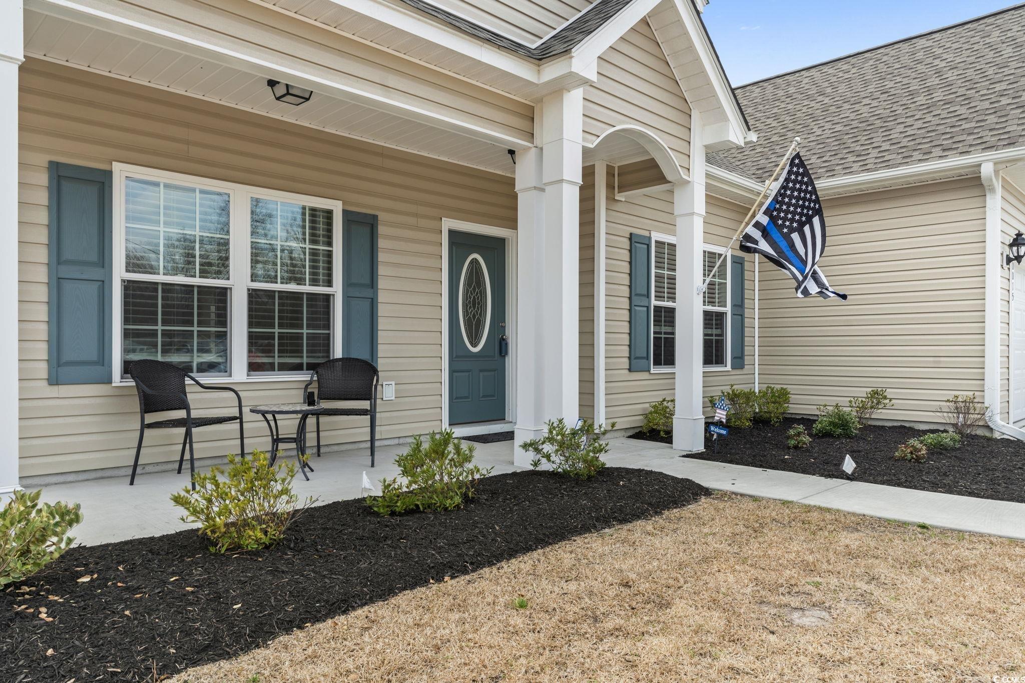 10015 West Highway 19 Loris, SC 29569 - Photo 39 of 40 Entrance to property with a porch and roof with sh
