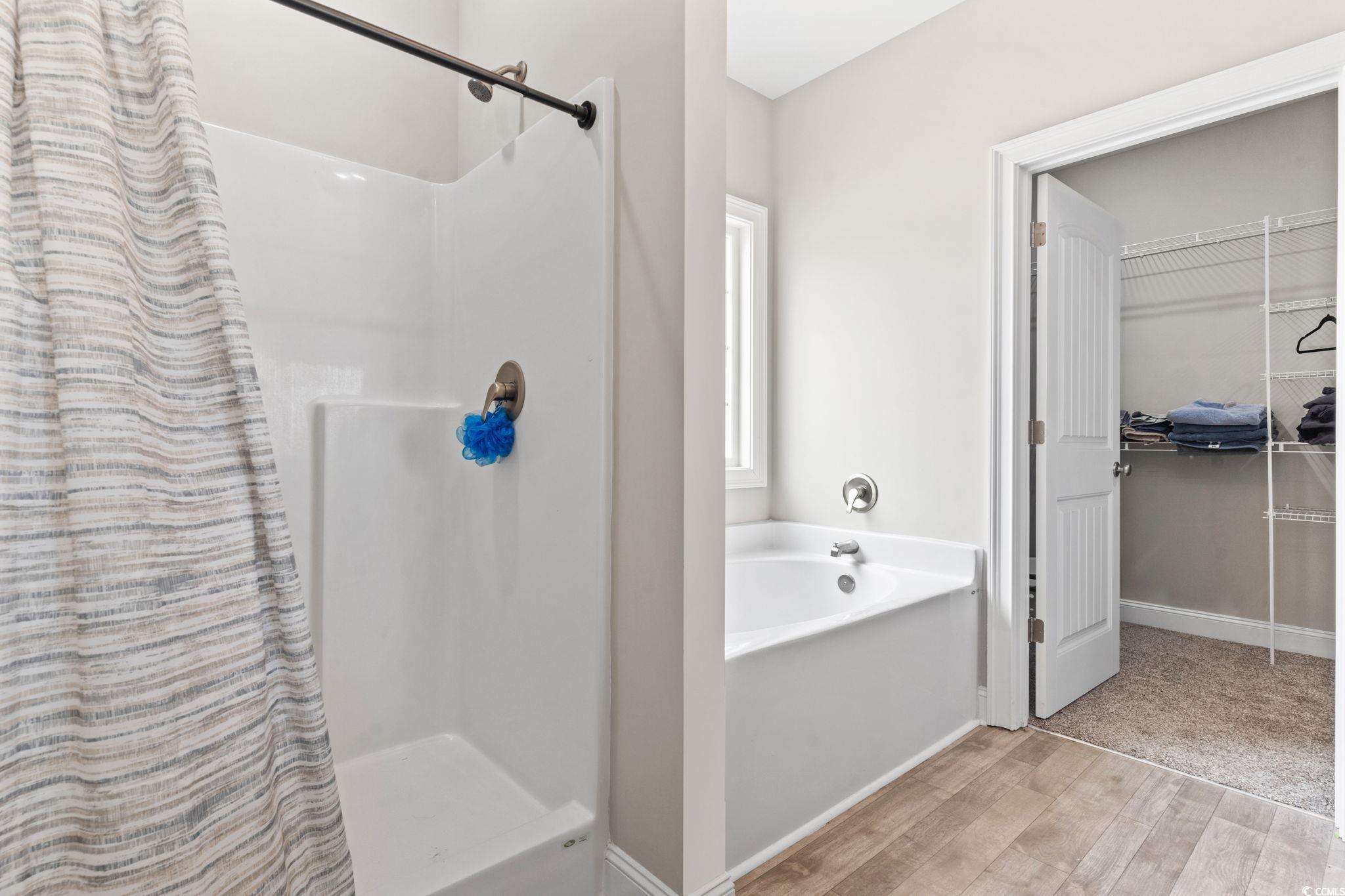10015 West Highway 19 Loris, SC 29569 - Photo 4 of 40 Bathroom featuring a stall shower, wood finished f