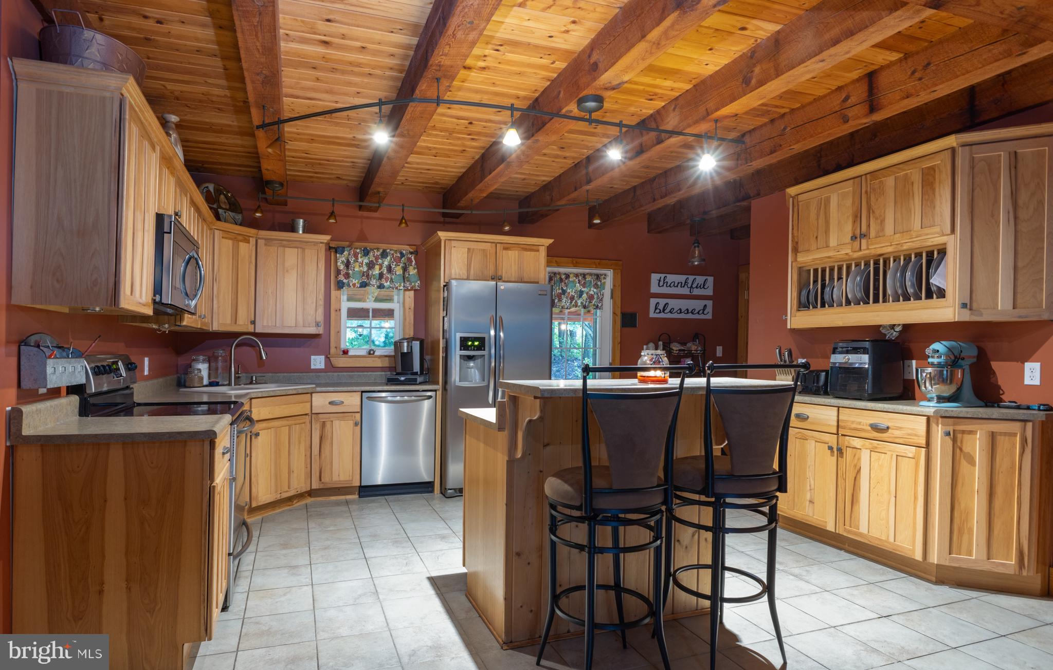 348 Decker Valley Road Spring Mills, PA 16875 - Photo 2 of 28 Warm wooden kitchen with modern charm.
