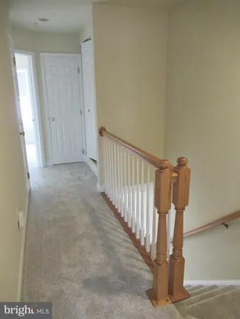 a view of an empty room and closet area