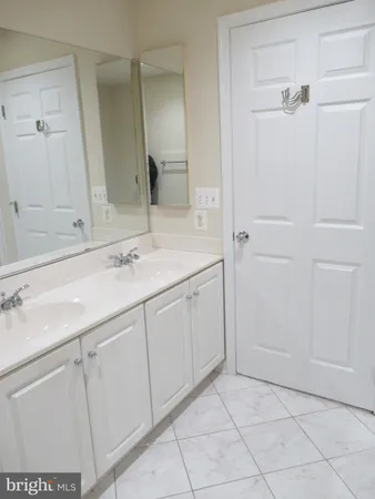 a spacious bathroom with bathtub and shower