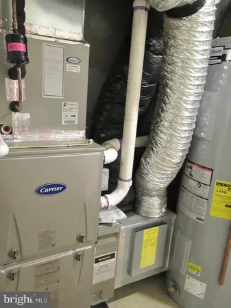 a view of a backyard with wooden fence