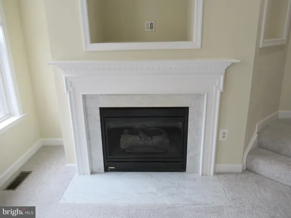 a bathroom with a sink a mirror and toilet