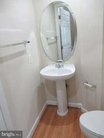 a kitchen with a sink a stove and a refrigerator