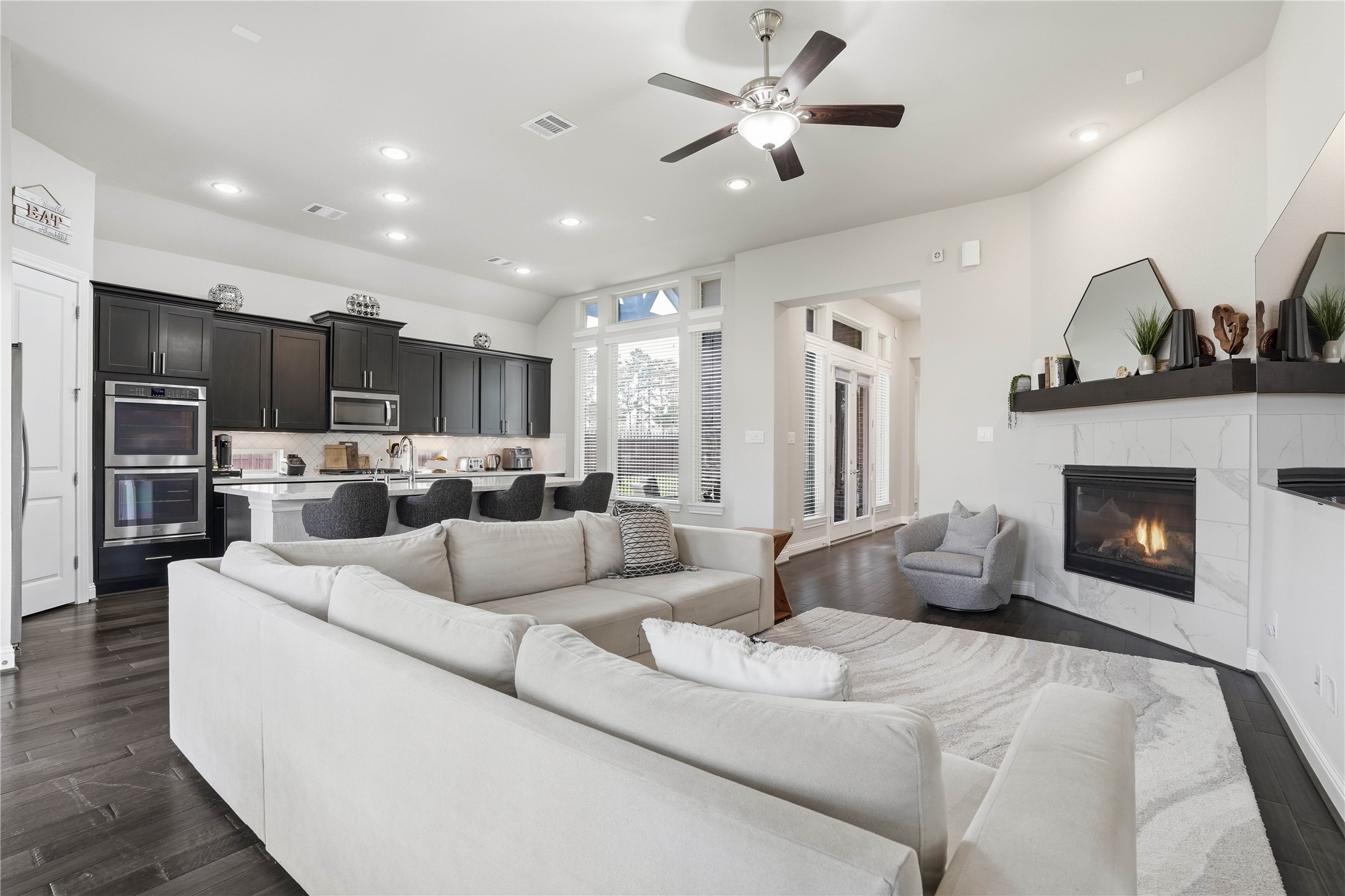 18606 Copano Lane Spring, TX 77379 - Photo 14 of 30 a living room with furniture fireplace and kitchen view